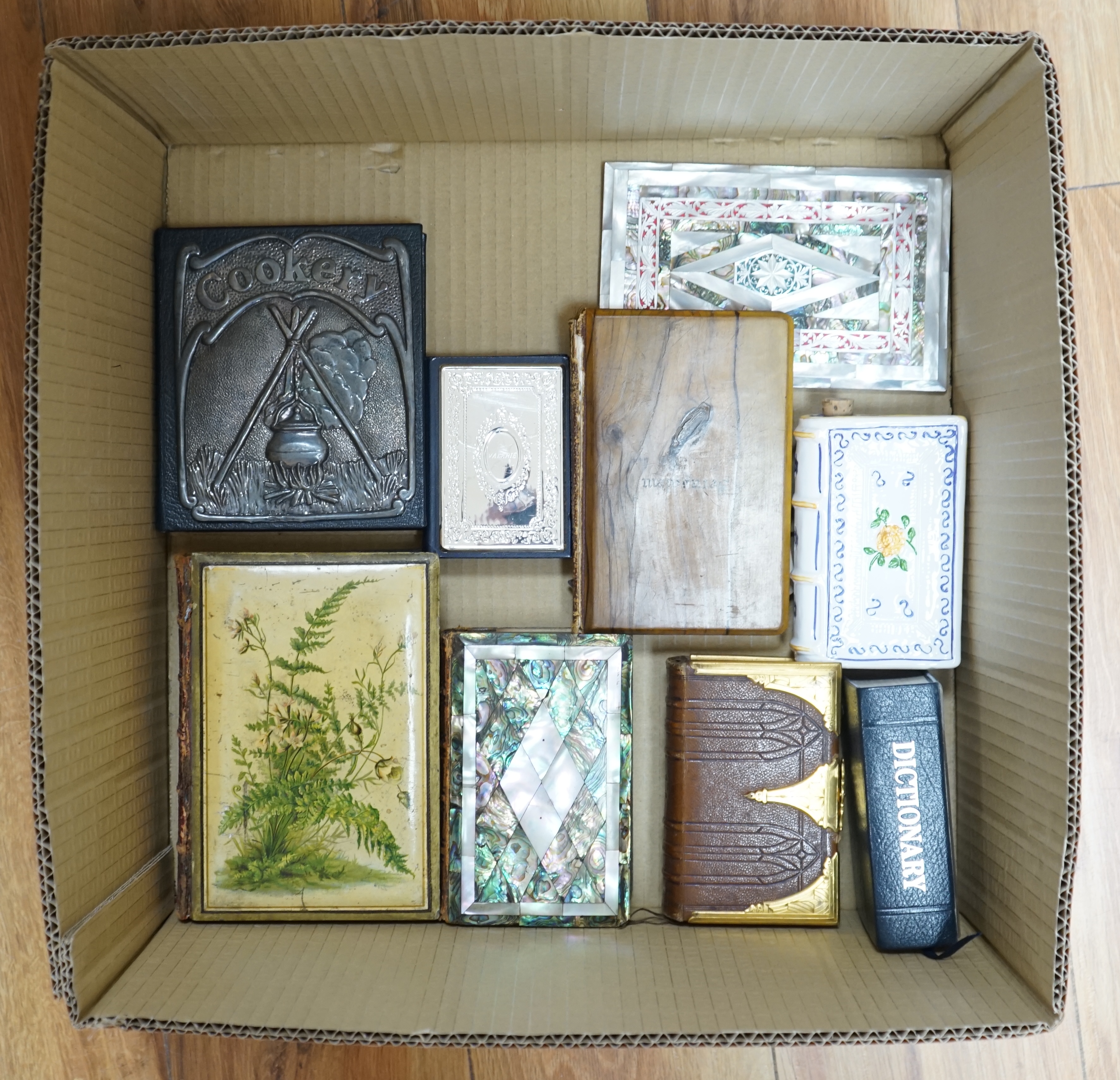 A small group of other assorted novelty bindings, including mother of pearl, leather and silver plate. Condition - varies